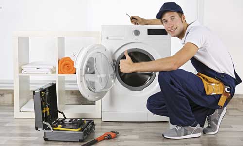 Technician inspecting a Beko washing machine